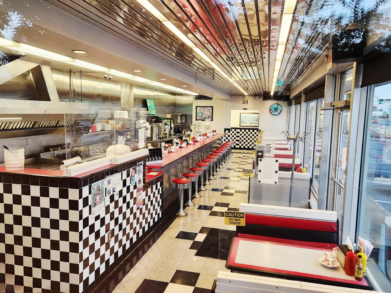 Long counter and black-and-white checkered trim inside Courtesy Diner, The Hill.